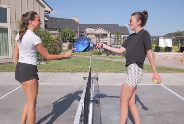 Two women playing pickleball